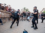 Armed riot police with shields clash with anti-tourism protesters in Mallorca as demonstrations turn violent