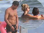 Orlando Bloom, 49, shows off his ripped physique in the beach shower as he puts on a cosy display with bikini-clad model girlfriend Luisa Laemmel, 28, at the beach in Italy