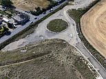 Villagers are left with a ’roundabout to nowhere’ after developers ditch plans to build 300 new homes