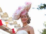 Glamorous Goodwood! Racegoers don sky-high fascinators, florals and feathers for a very colourful Ladies’ Day in West Sussex
