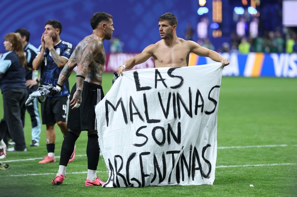 Argentina players brandish controversial Falkland Islands banner after beating England in World Cup