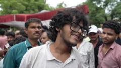 Protesters celebrate resignation of India’s education minister