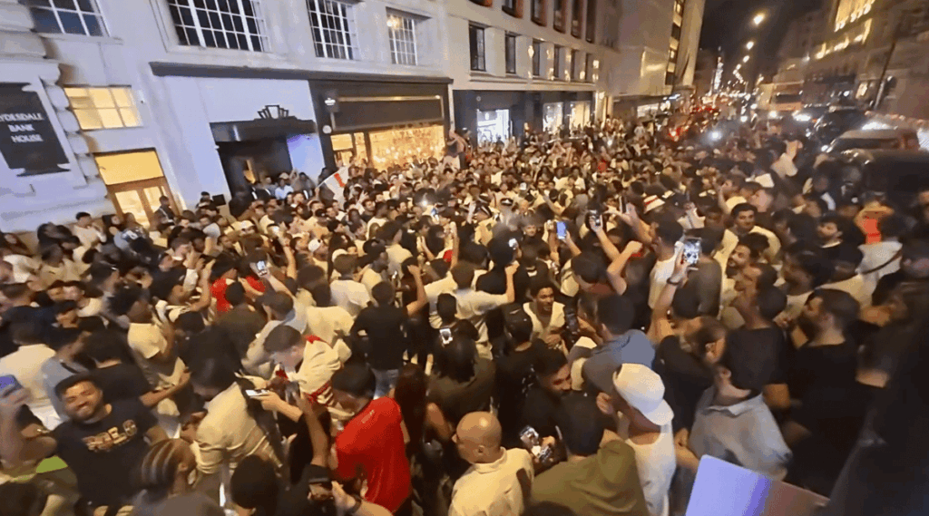 Moment England fans block traffic in central London as they celebrate World Cup win over Norway