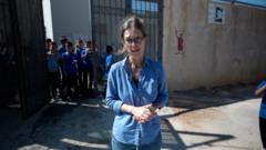 Pupils return to West Bank school behind barbed wire to protect against settlers