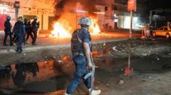 ‘You’re not alone in the darkness’: Gambia president urges calm after violent blackout protests