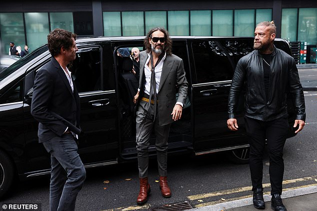 British actor and comedian Russell Brand arrives at Southwark Crown Court where he stands trial on charges of rape and sexual assault involving six women between 1999 and 2009, which he denies, in London, Britain, October 13, 2026. REUTERS/Jack Taylor