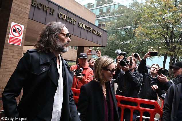 LONDON, ENGLAND - OCTOBER 20: Russell Brand and his wife, Laura Brand, leave court during his trial, where he faces rape and sexual assault charges at Southwark Crown Court on October 20, 2026 in London, England. Russell Brand has been charged with three counts of rape, three counts of sexual assault and one count of indecent assault. He has denied all charges. (Photo by Alishia Abodunde/Getty Images)